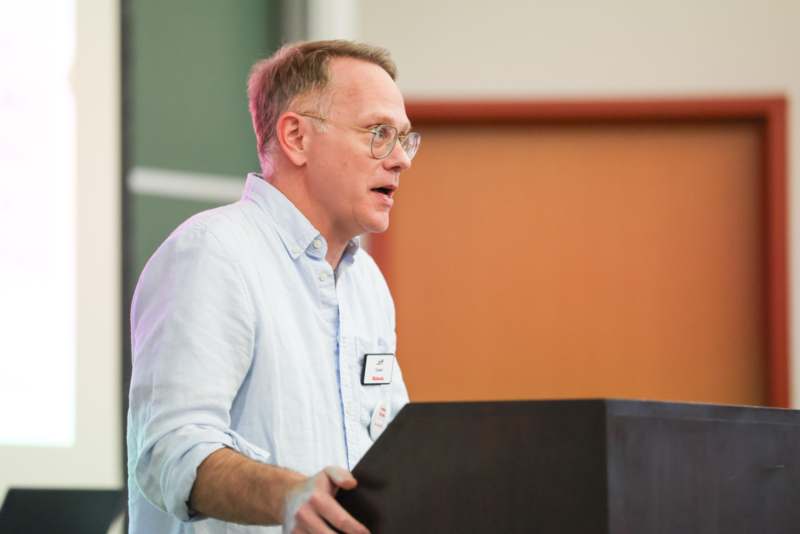 a man standing at a podium
