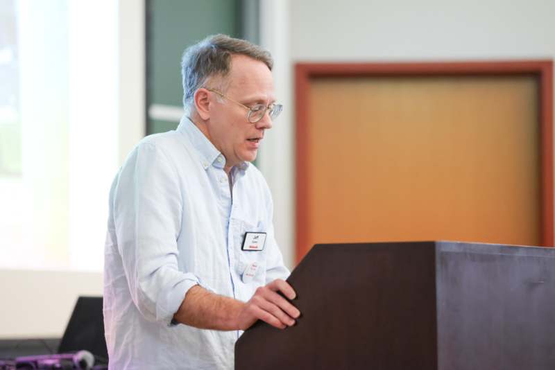 a man standing at a podium
