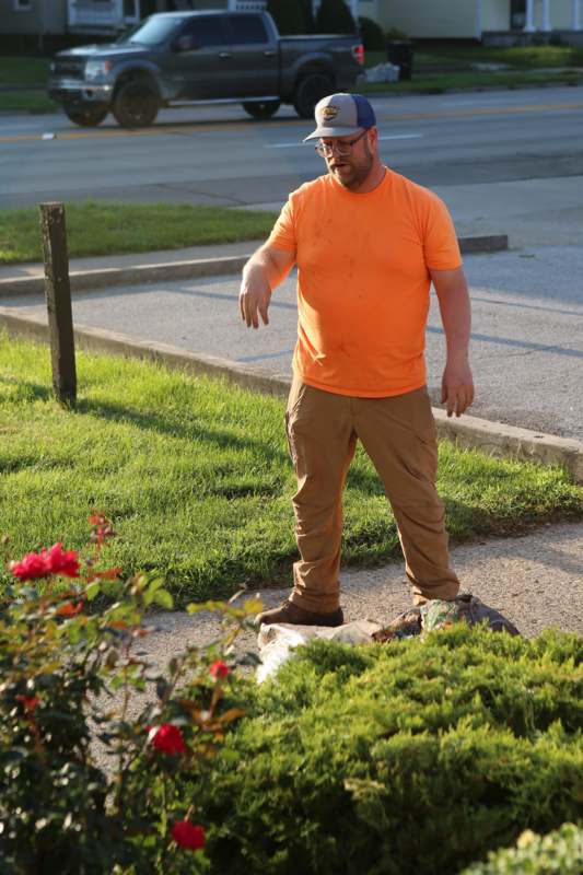 a man standing on a sidewalk