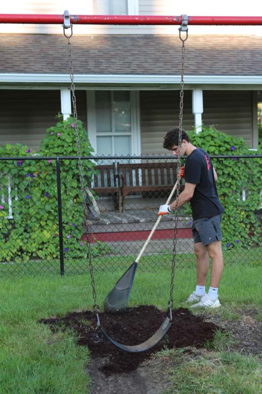 a man digging in the dirt