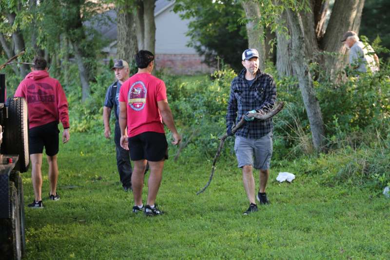 a group of men walking in the grass