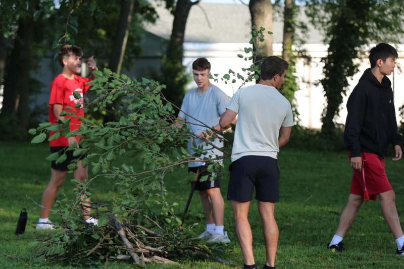 a group of men outside in the sun