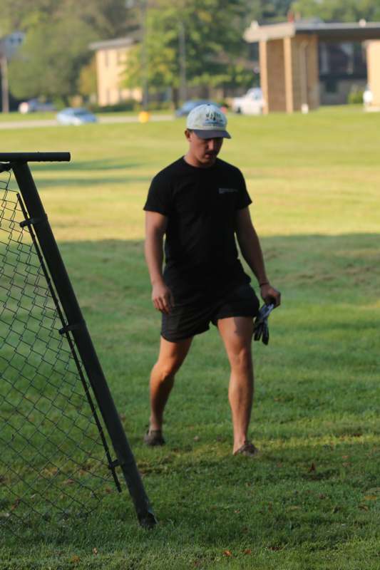 a man walking on grass