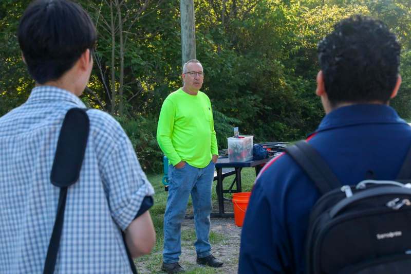 a man standing in front of a group of people