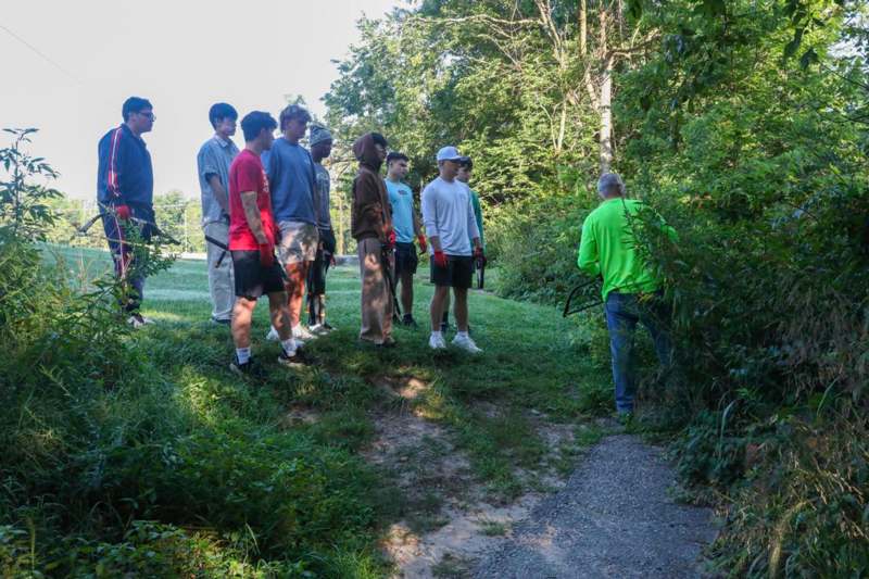 a group of people standing on a hill