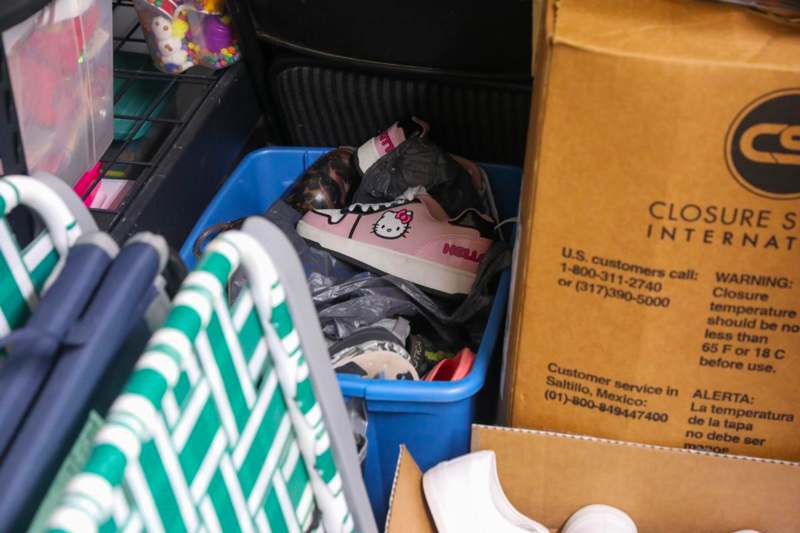 a basket full of shoes and a cart