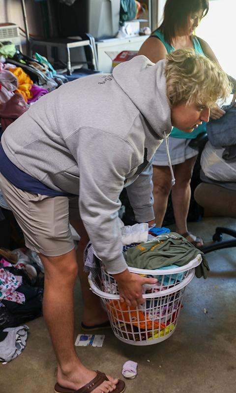 a man holding a laundry basket