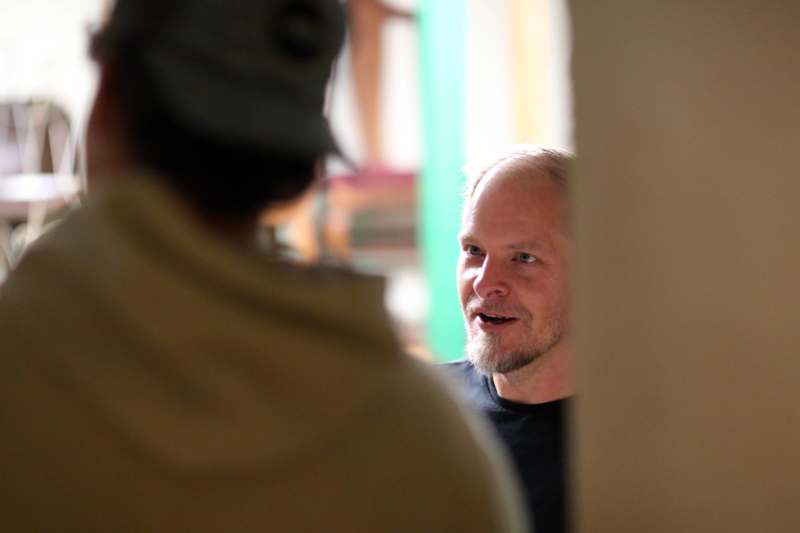 a man talking to another man