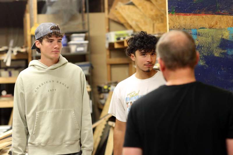 a group of men standing in a room