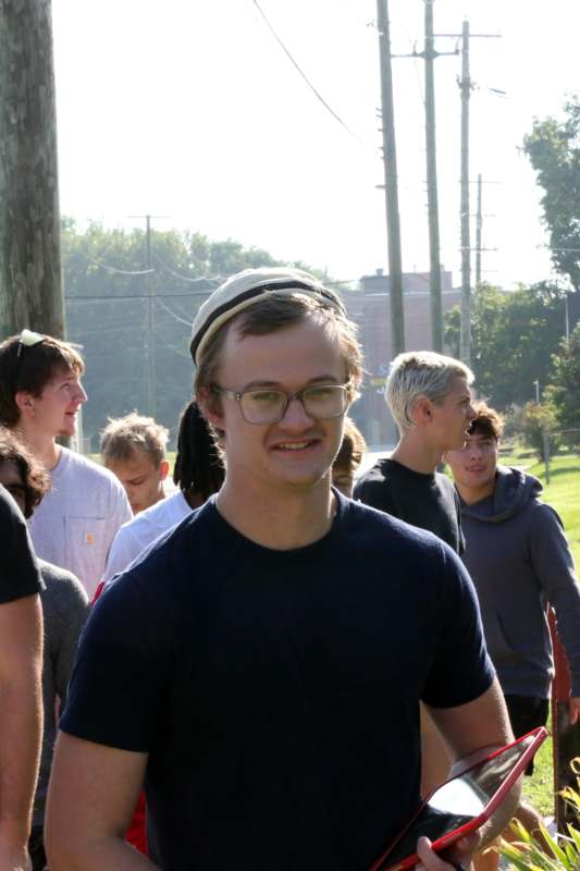 a man in a hat and glasses