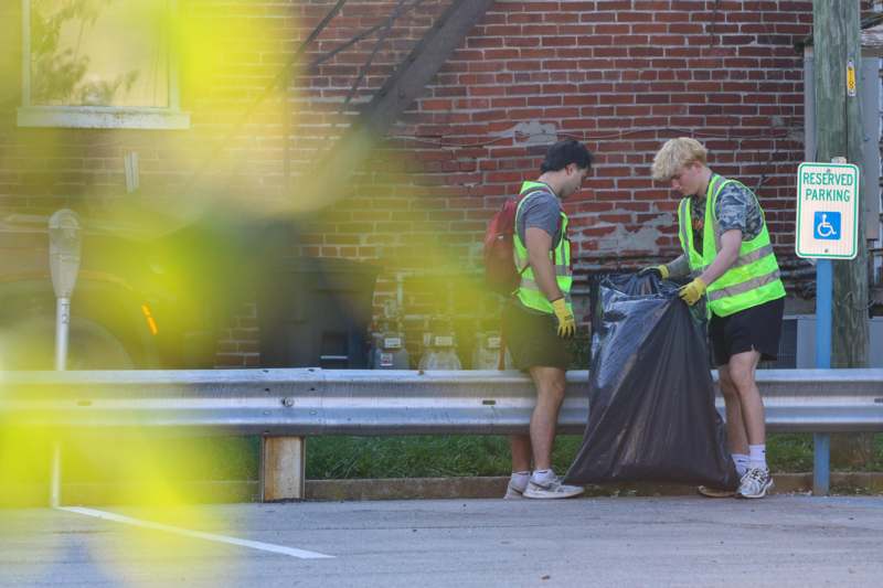 a group of men wearing reflective vests and gloves