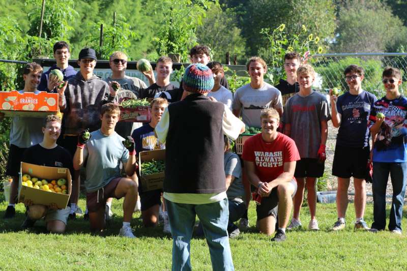 a group of people standing in a field