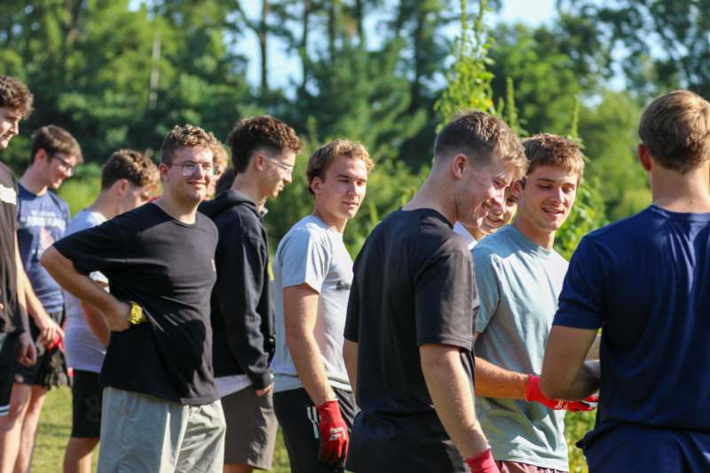 a group of men standing in a line