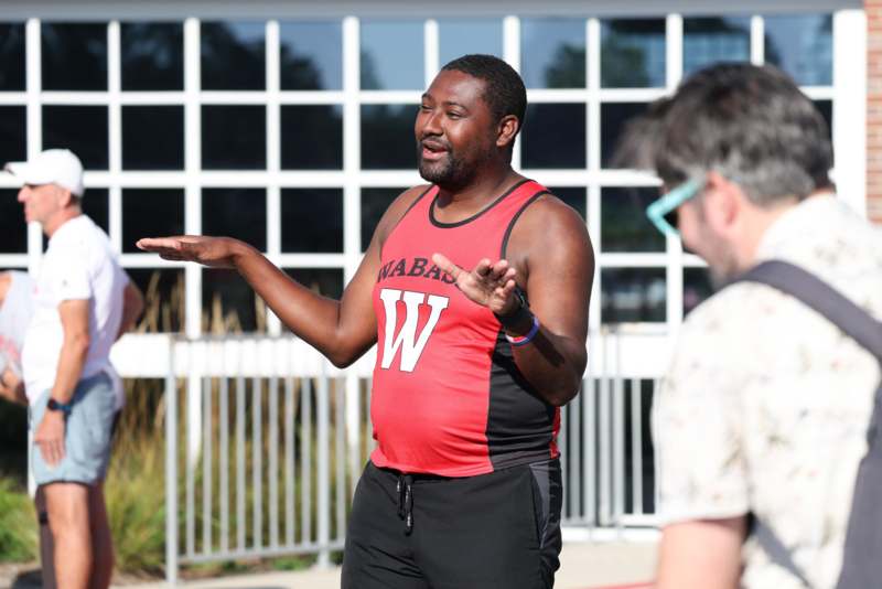 a man in a red tank top