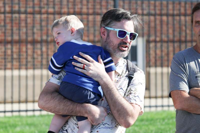 a man holding a baby