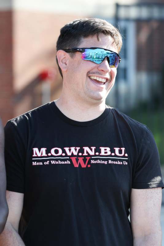 a man wearing sunglasses smiling