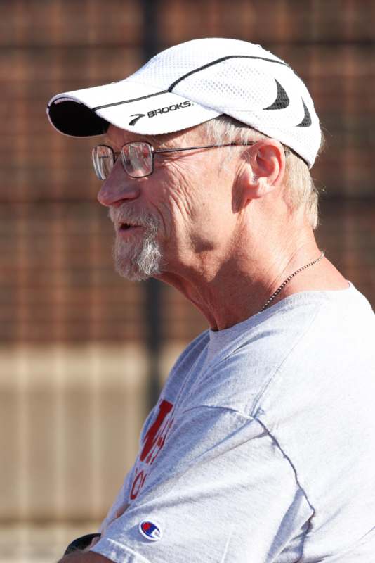 a man wearing a hat and glasses