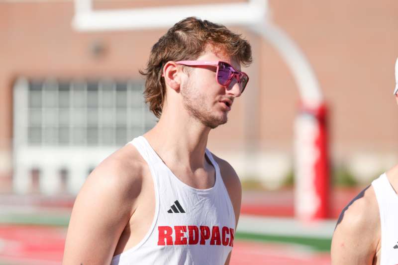 a man wearing pink sunglasses