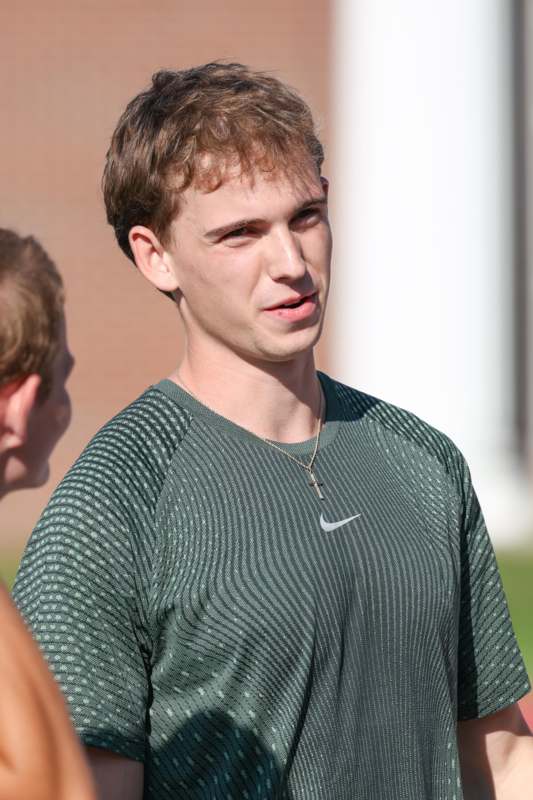 a man in a green shirt