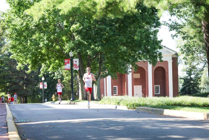 a group of people running on a road