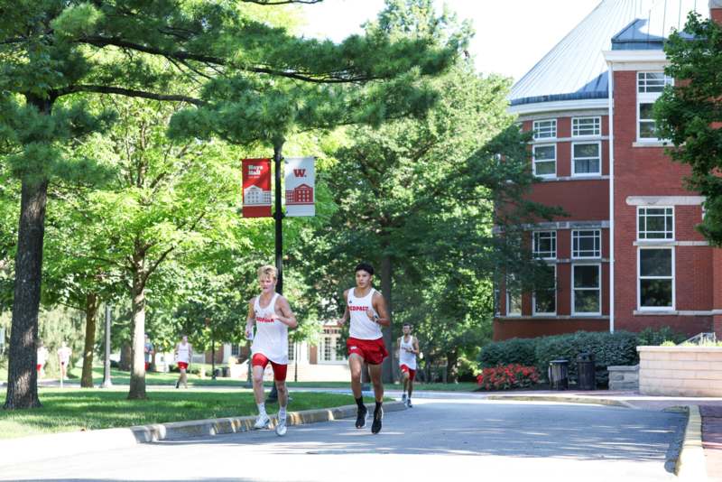 a group of people running on a street
