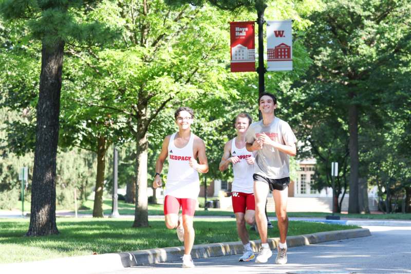 a group of people running on a street