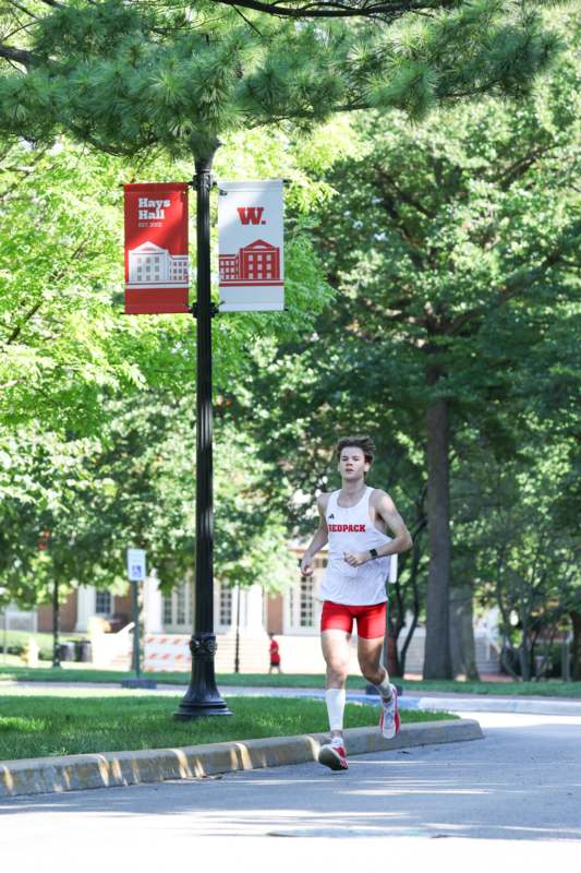 a man running on a sidewalk