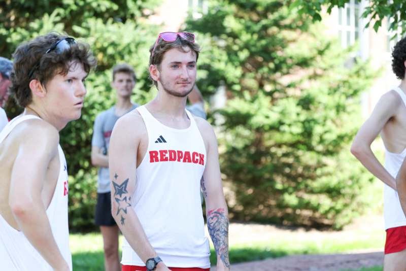 a group of men standing outside