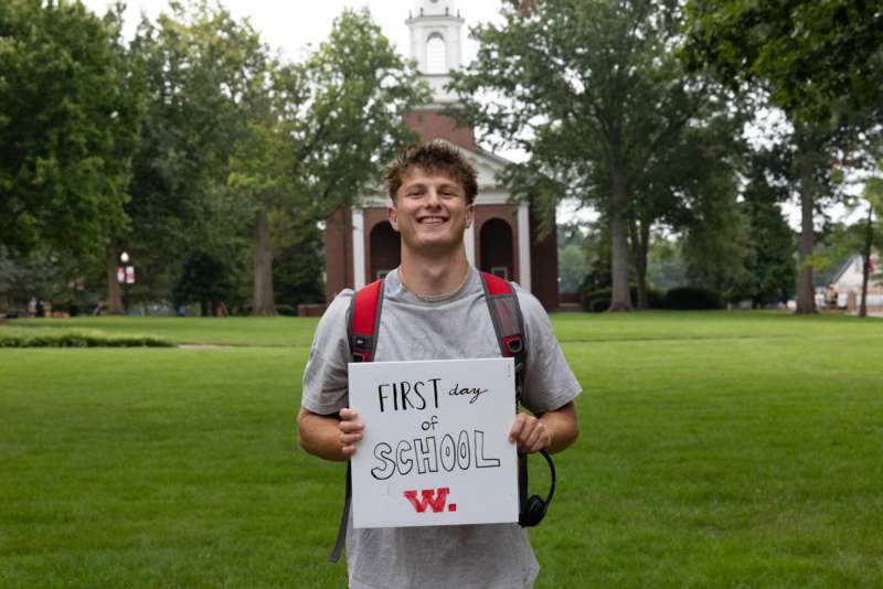 a man holding a sign