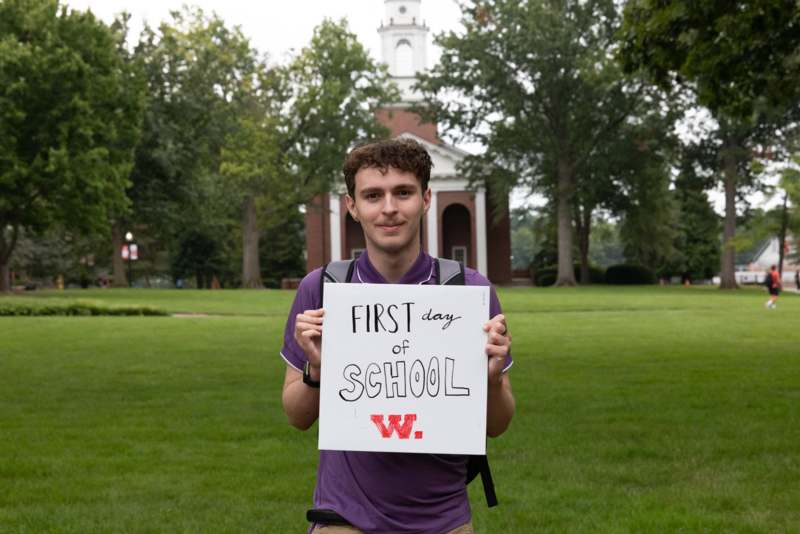 a man holding a sign