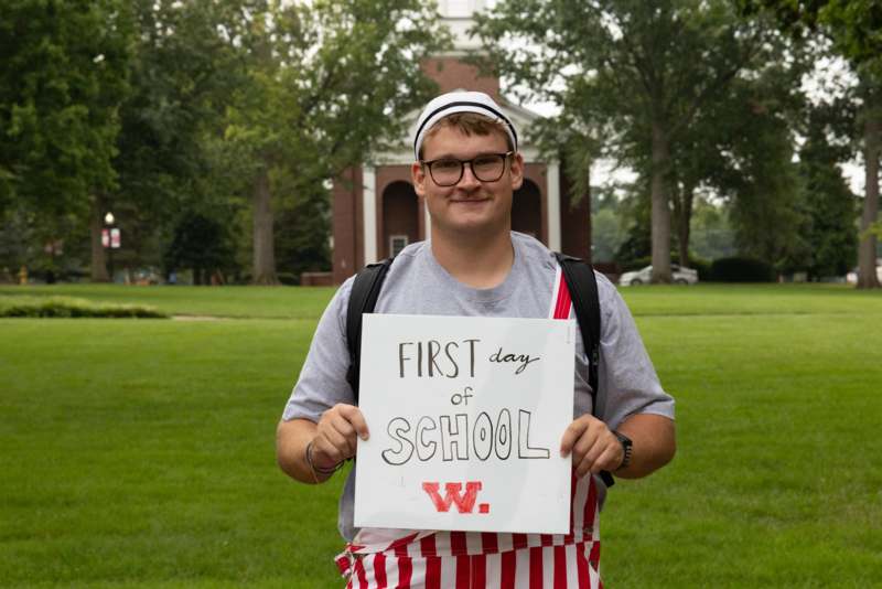a man holding a sign