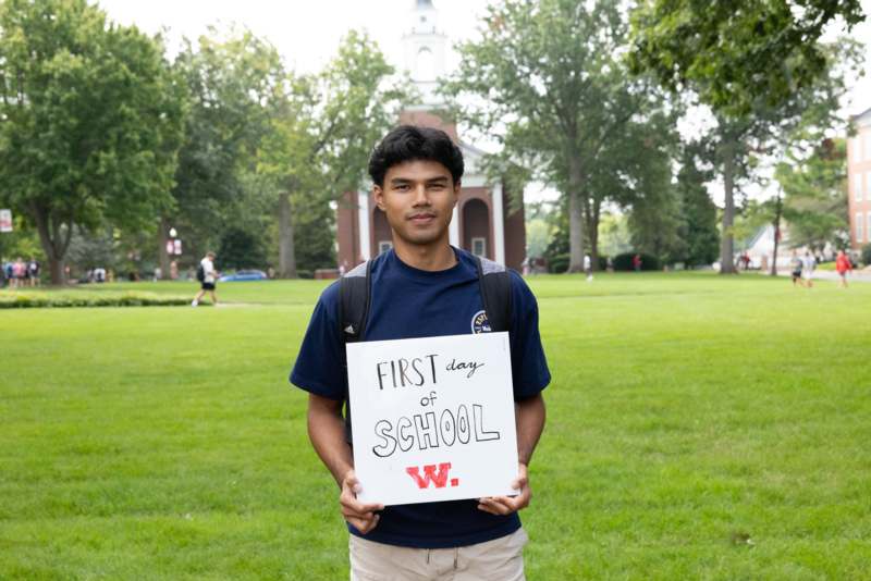 a man holding a sign