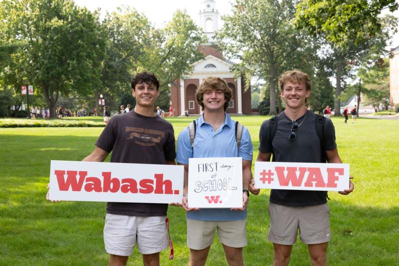 a group of men holding signs