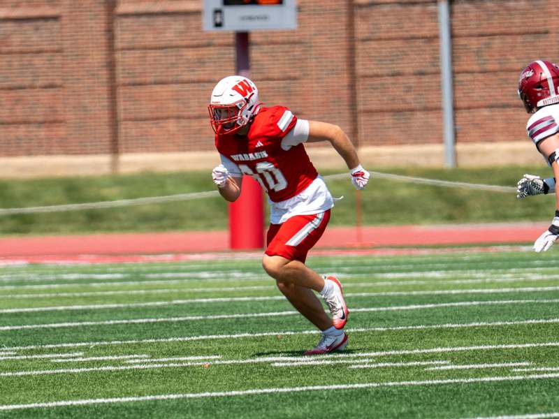 a football player running on a field