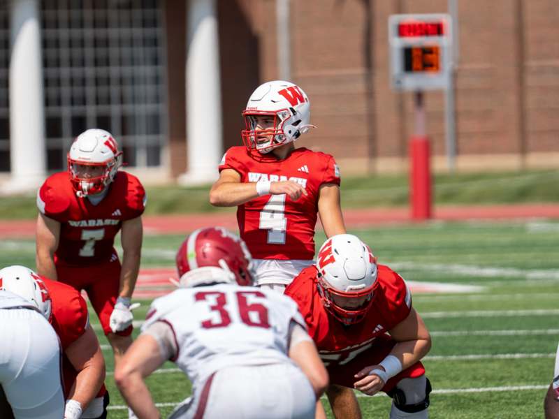 a football player in a red uniform
