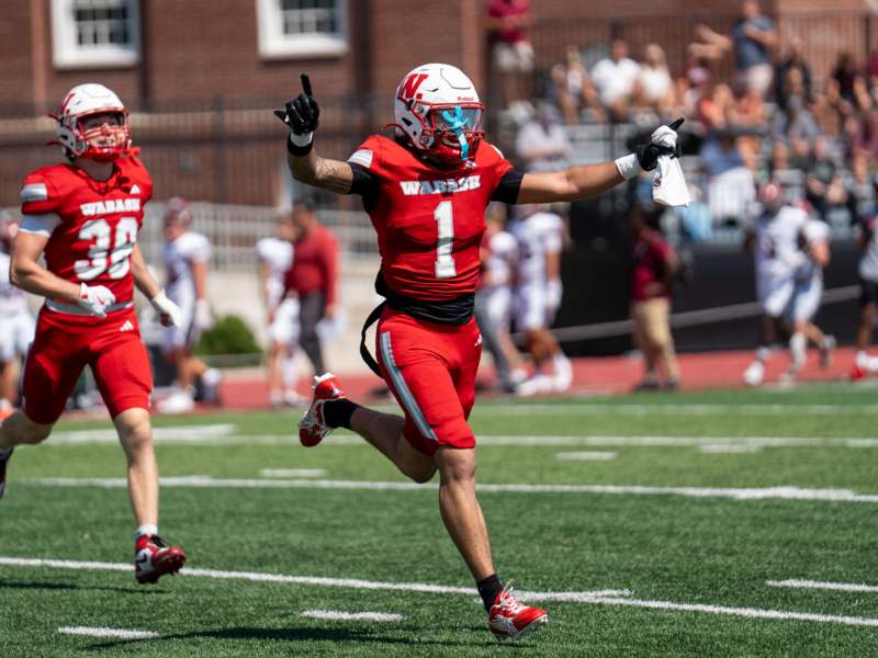 a football player running on a field