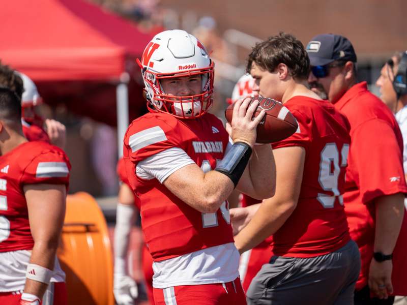a football player holding a football
