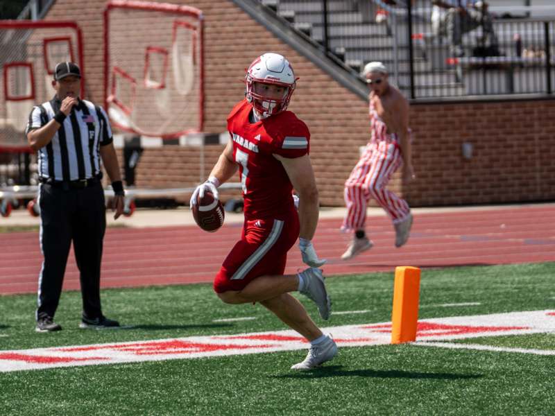 a football player running with a football