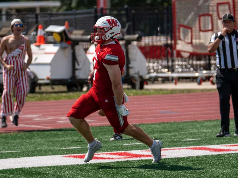 a football player running on a field