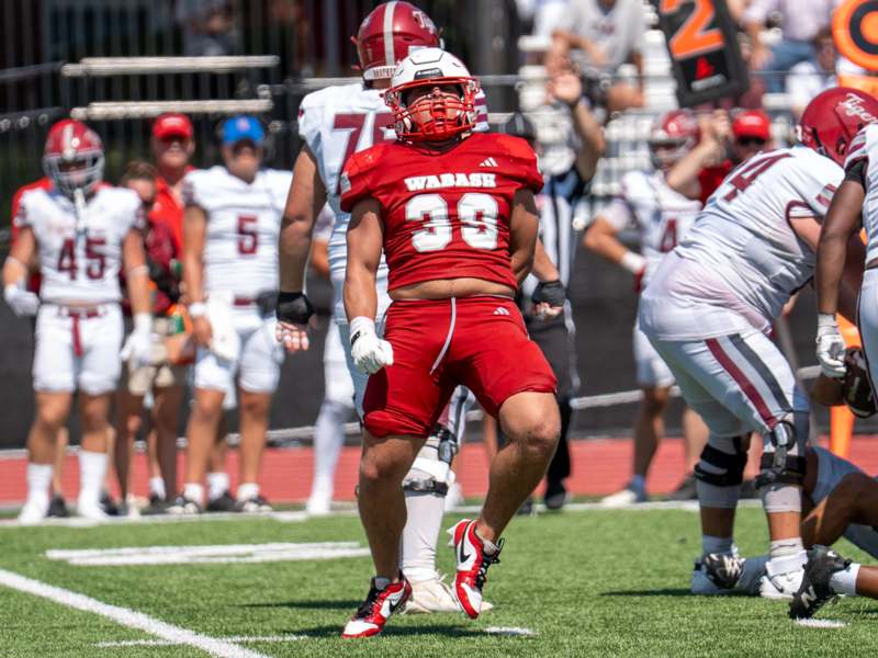 a football player in a red uniform