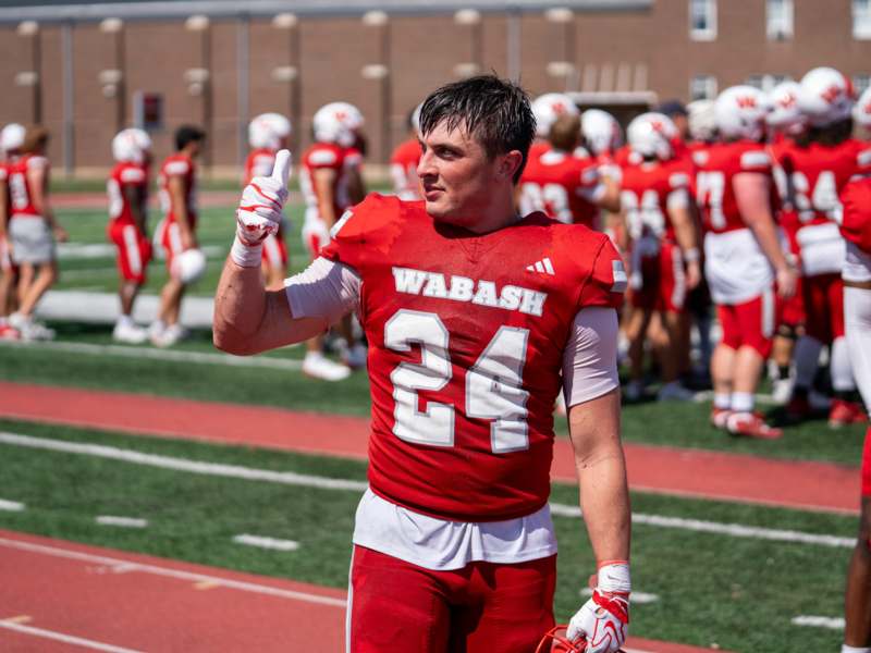a football player giving a thumbs up