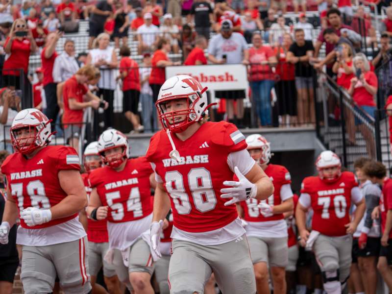 a football players in red and white uniforms