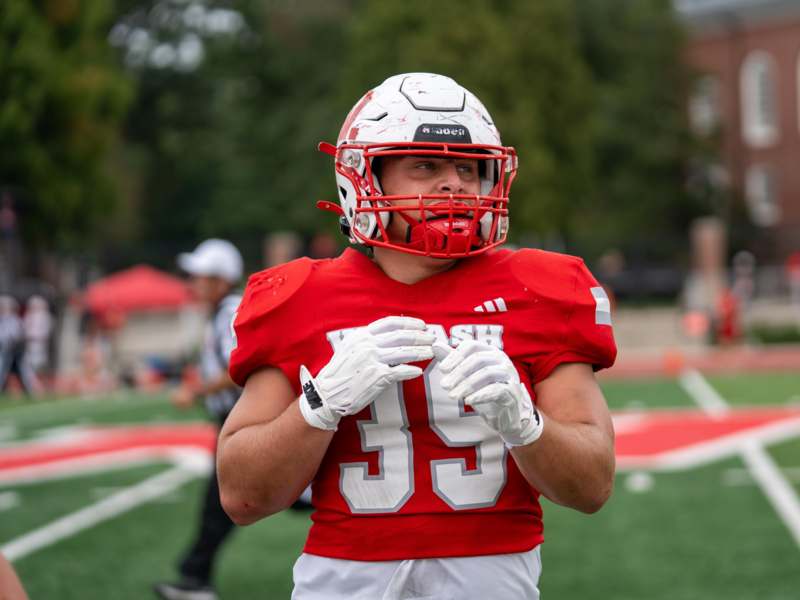 a football player in a red uniform