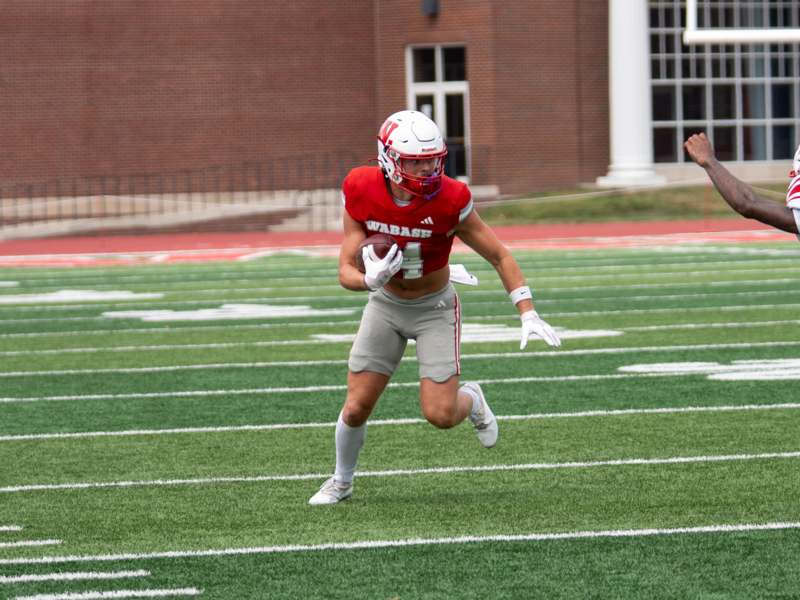 a football player running on a field