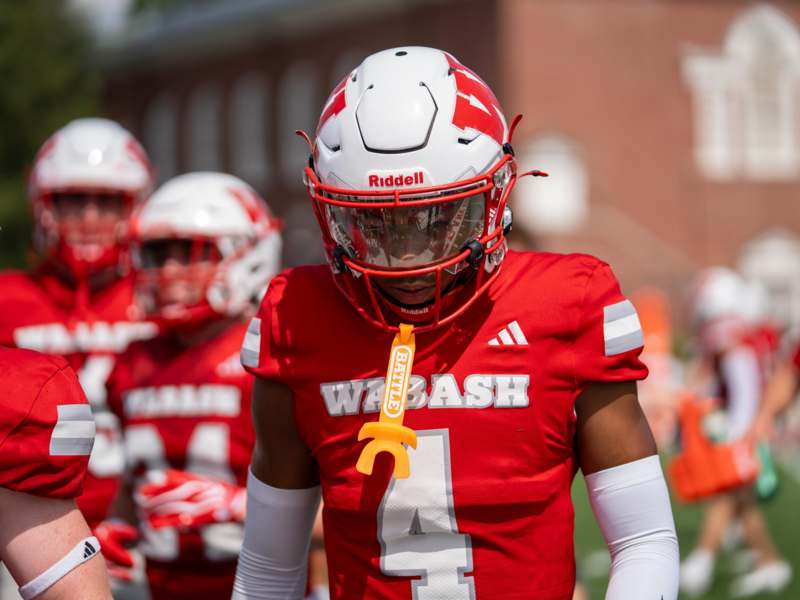 a football player in a red uniform