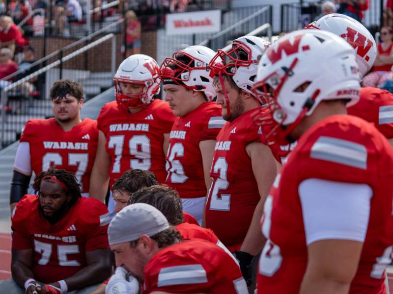 a group of football players in red uniforms