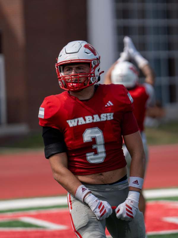 a football player in a red uniform