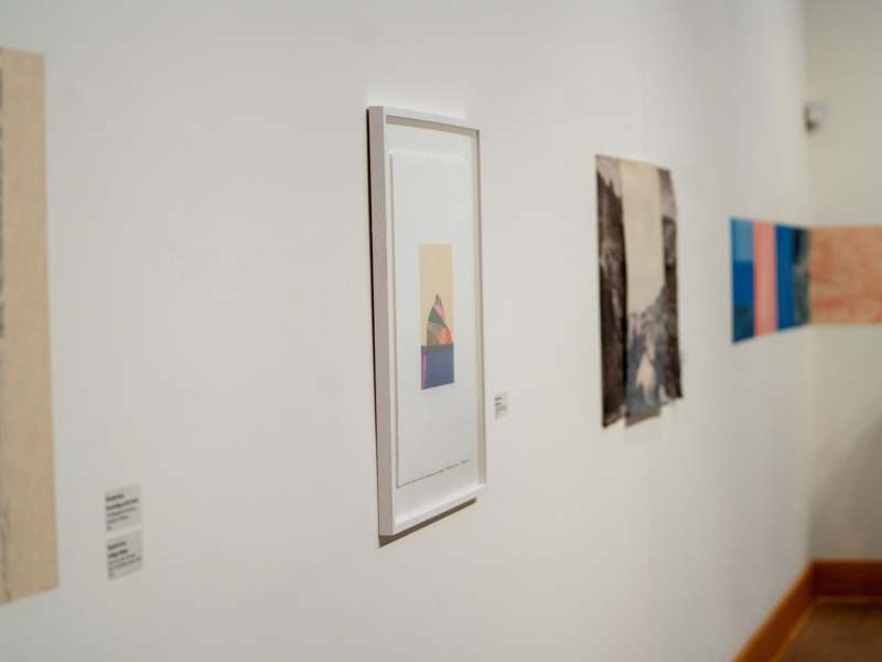 a group of art pieces on a wall