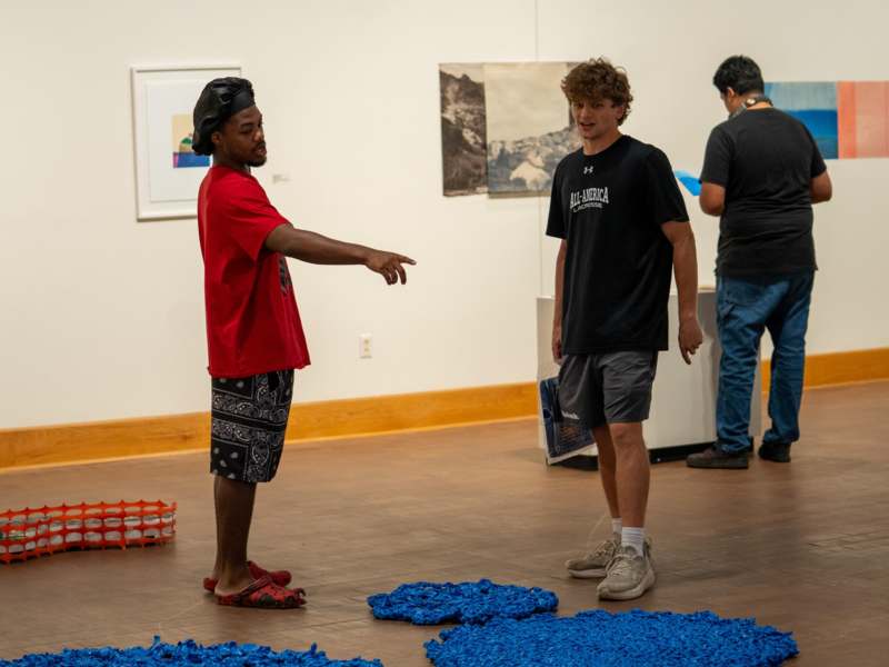 a man pointing at another man