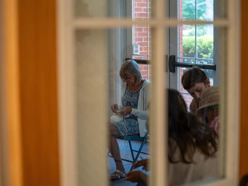 a group of people sitting in a chair